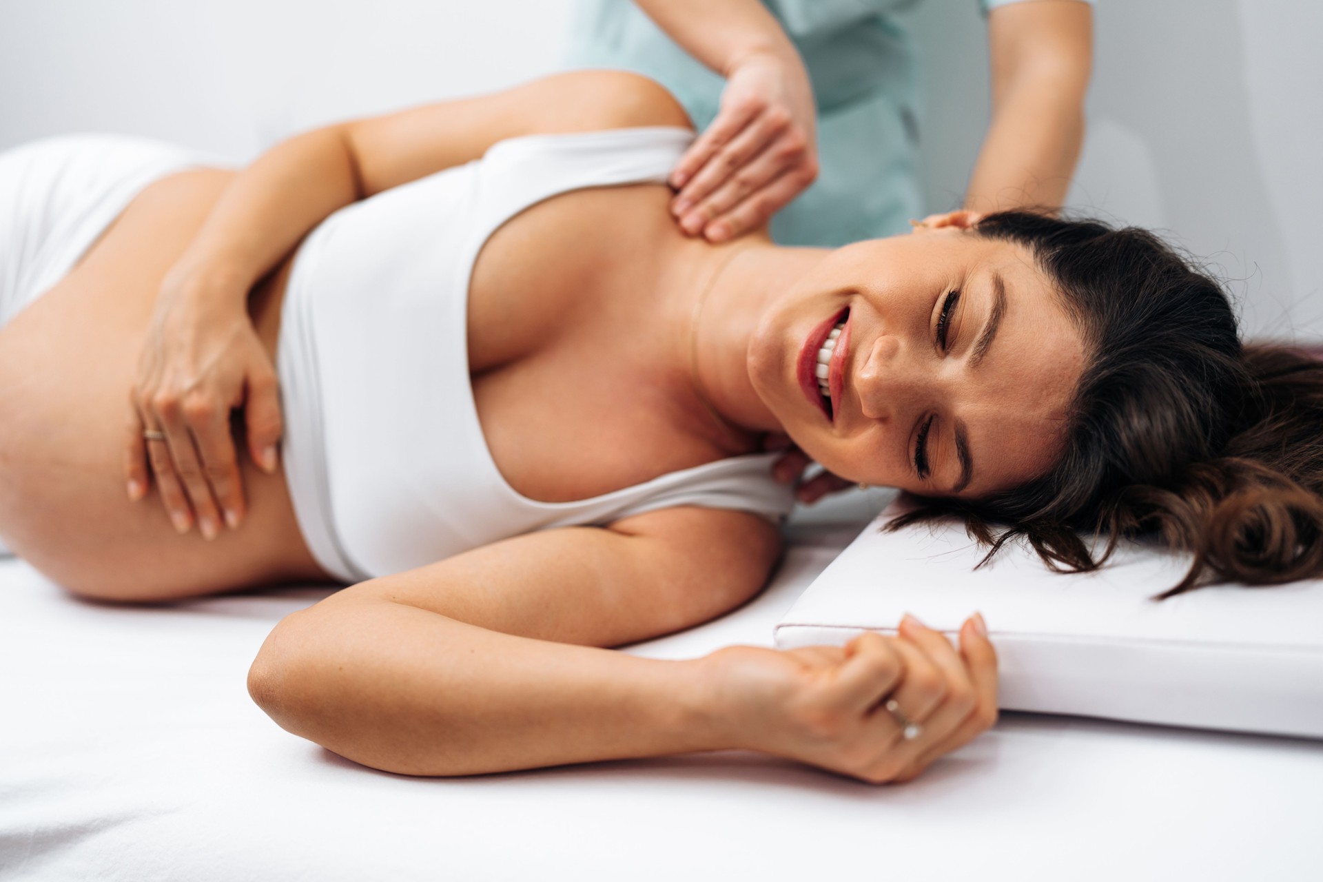 Pregnant woman at relaxing massage