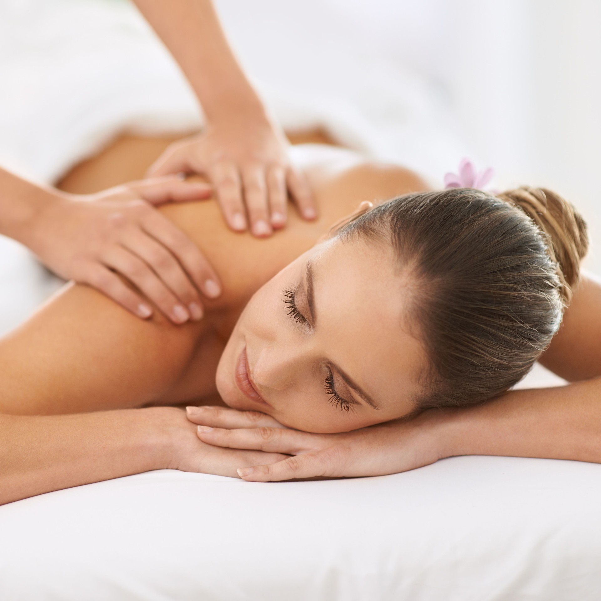 Woman enjoying a Swedish massage for stress relief and relaxation